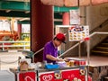 CHINATOWN, SINGAPORE Ã¢â¬â 26 DEC 2019 Ã¢â¬â An elderly middle-aged Asian Chinese man sells ice-cream wafers / ice-cream sandwiches